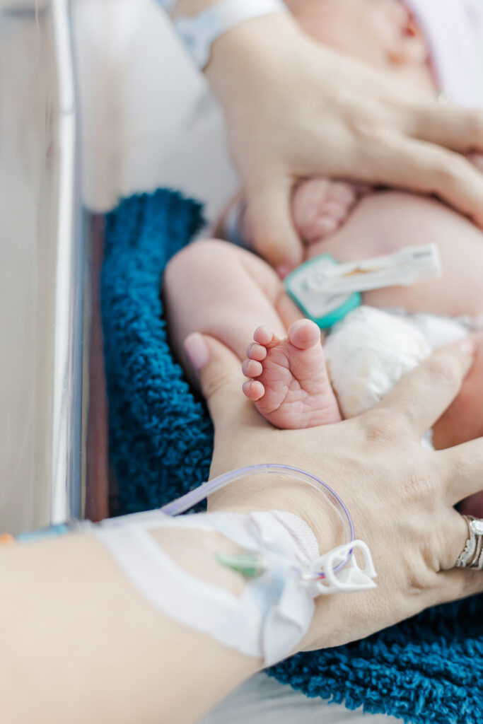 Newborn baby James peacefully resting in his hospital bassinet, showing off his delicate features during a Fresh 48 photo session at Grandview Medical Center.