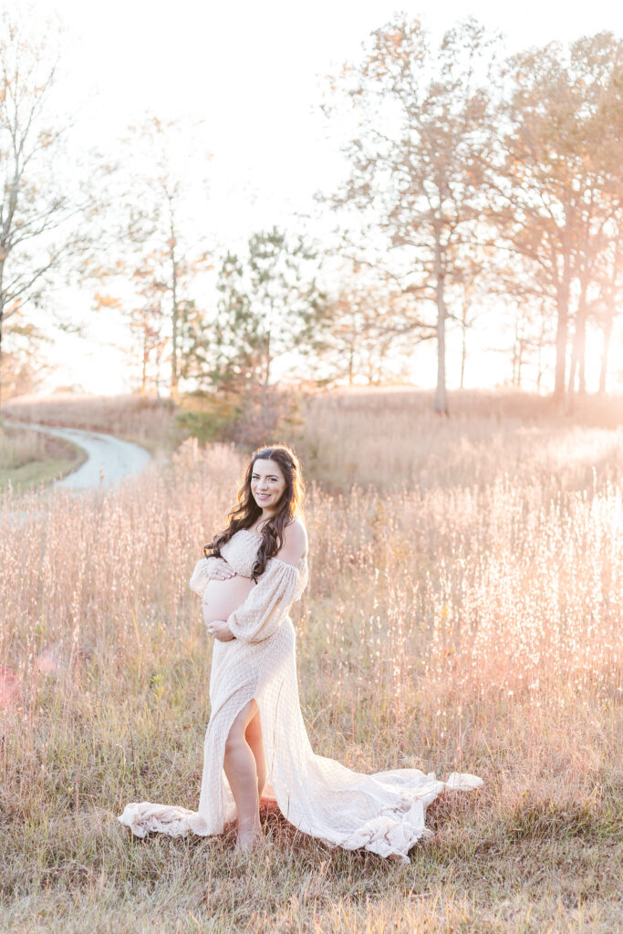 Creative maternity photo in a serene fall setting, captured by 5U Photography at a private boho field in Birmingham, AL