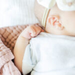 close up of newborn baby girl's hand during milestone membership session