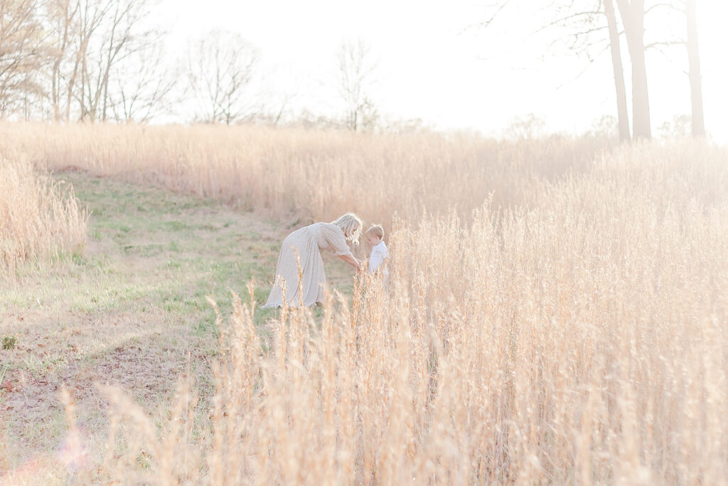 mother and son standing in boho field outside of Birmingham, AL 