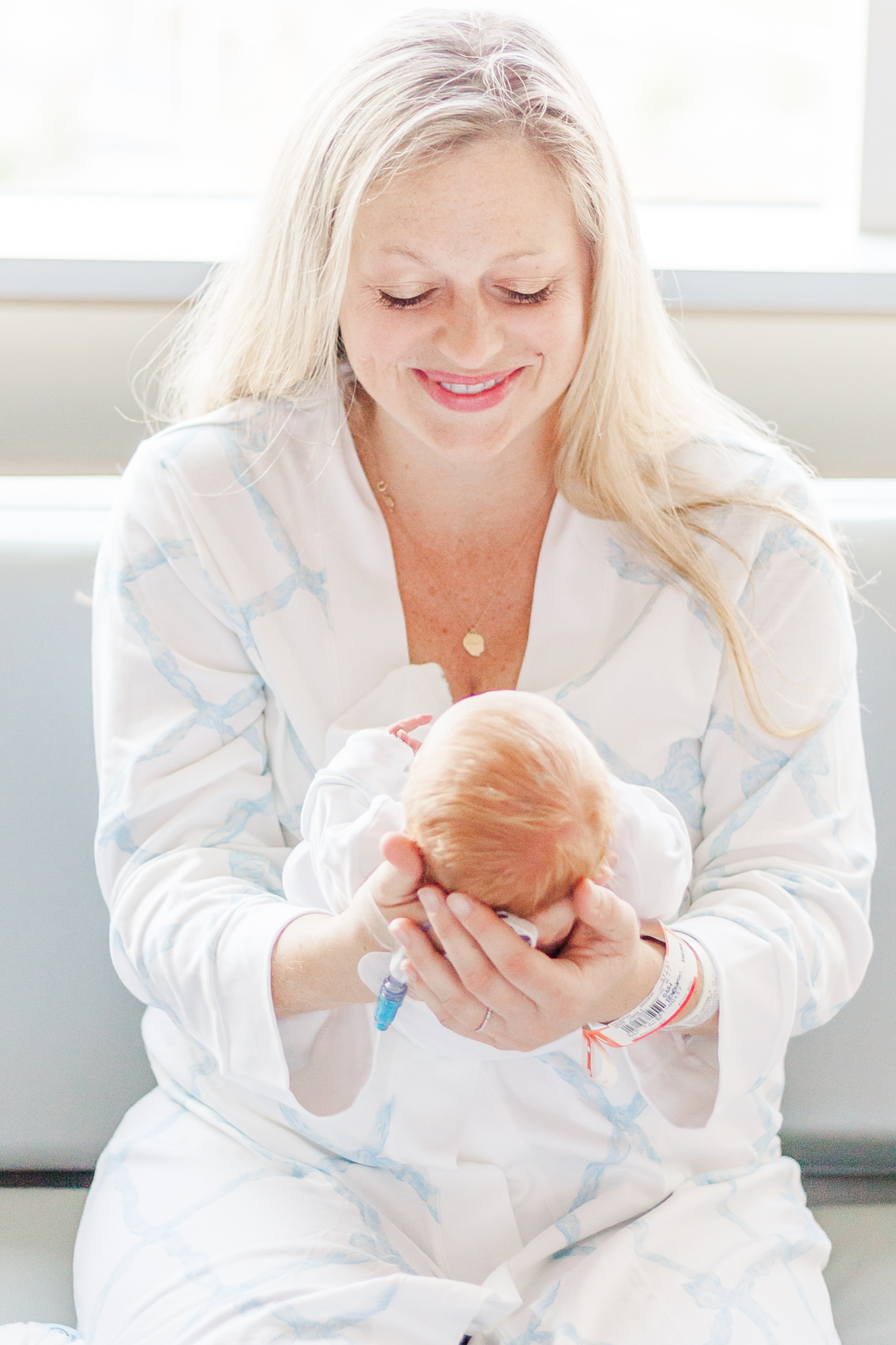 Mom sitting holding baby after delivery at Grandview Medical Center