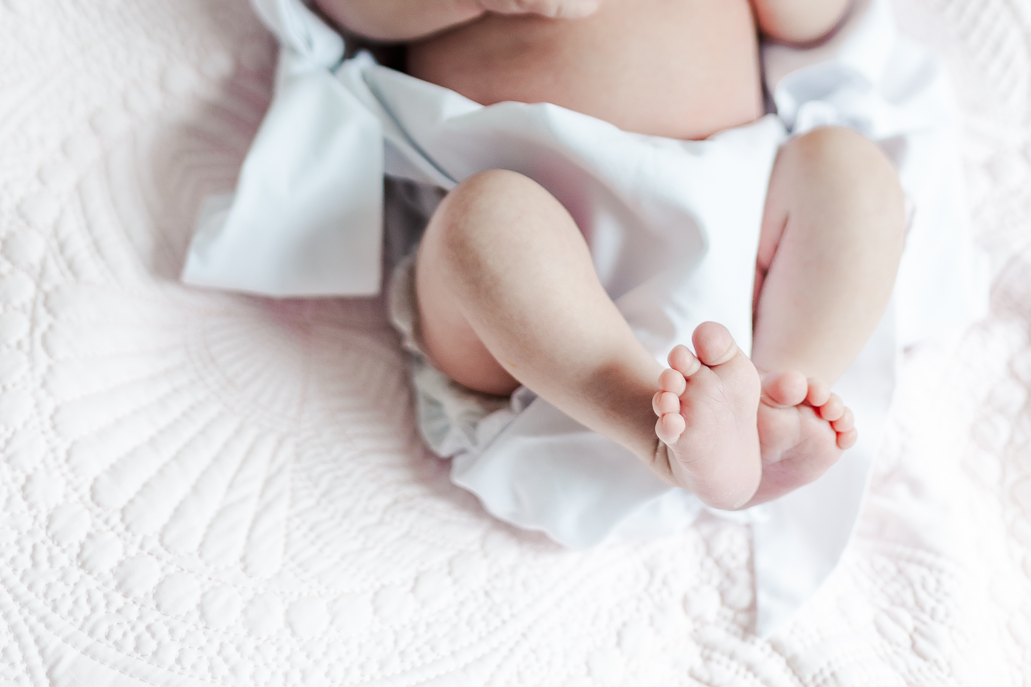 close up picture of newborn baby girls feet 