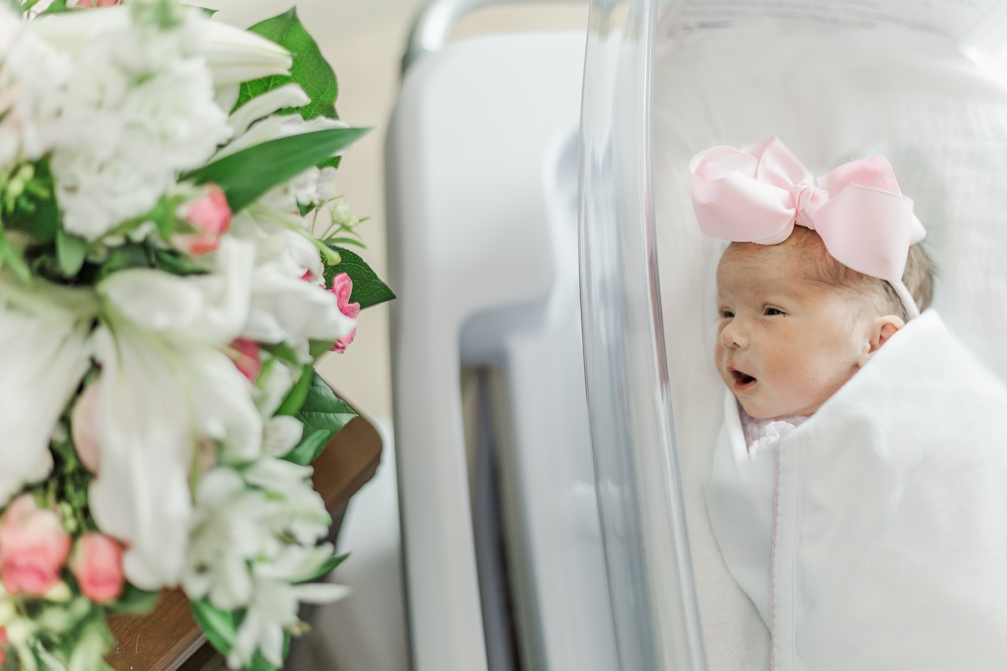 Newborn baby girl laying in hospital crib at Brookwood Hospital in Birmingham, Alabama following delivery