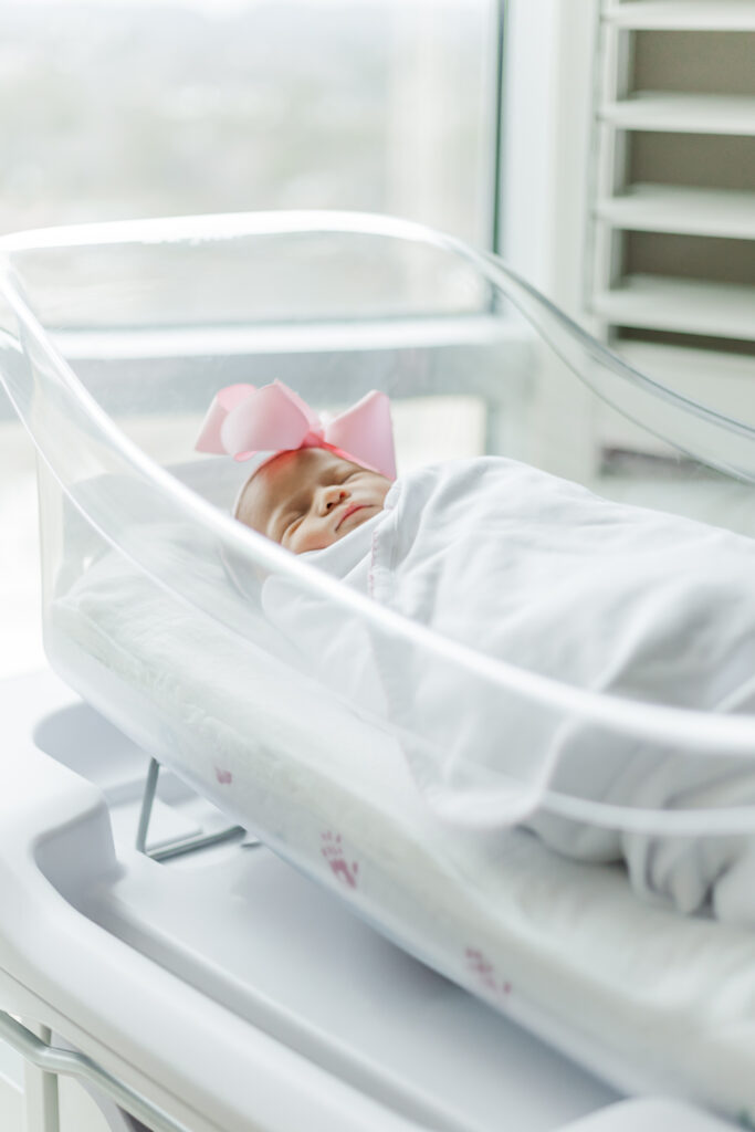 Newborn baby Ella Jo resting peacefully in her hospital bassinet at Brookwood Hospital in Birmingham, Alabama, during her Fresh 48 session