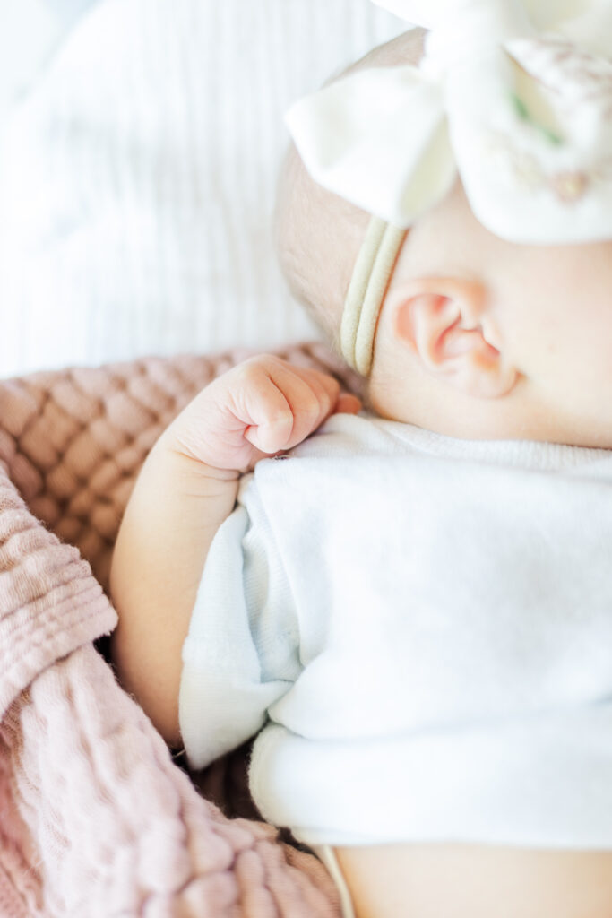 close up of newborn baby girl's hand during milestone membership session