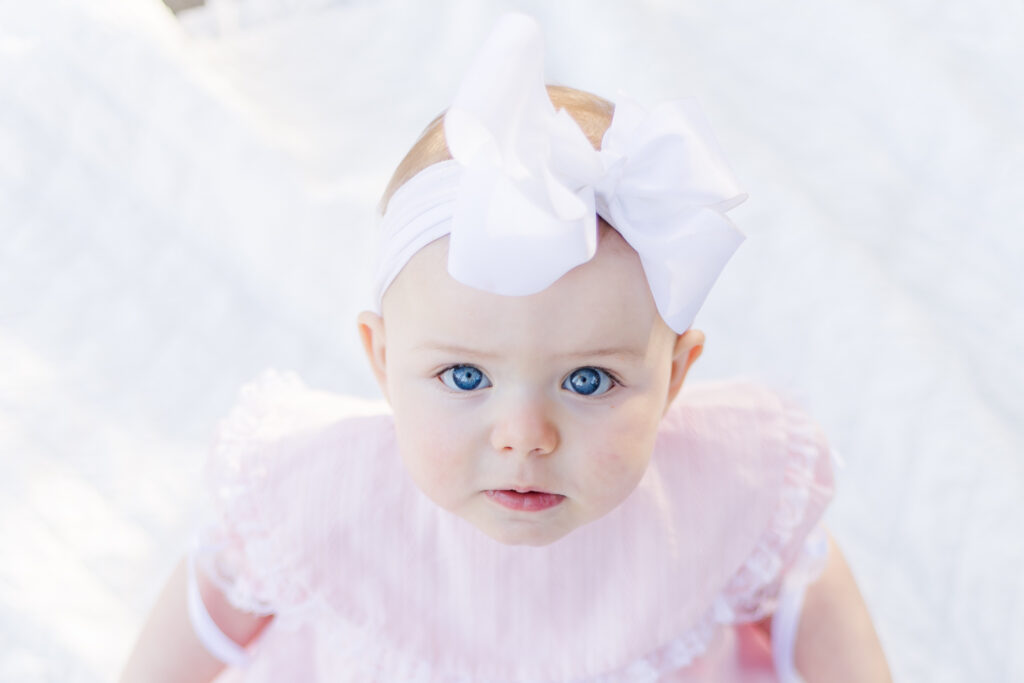 close up picture of 12 month old little girl during photo session with 5U Photography