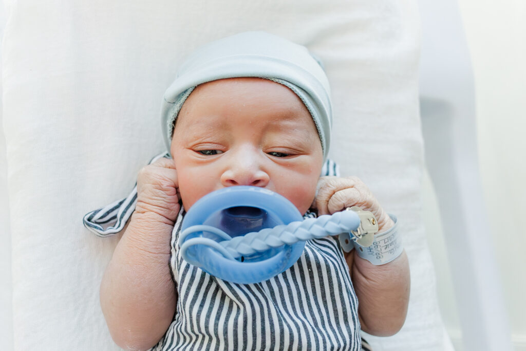 Close-up of baby Ezra’s peaceful face resting on a hospital pillow during his Birmingham AL Fresh 48 photoshoot