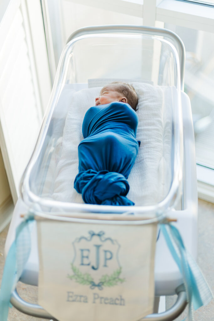 Newborn baby Ezra peacefully sleeping in his hospital crib at Brookwood Hospital  during his Fresh 48 session in birmingham al