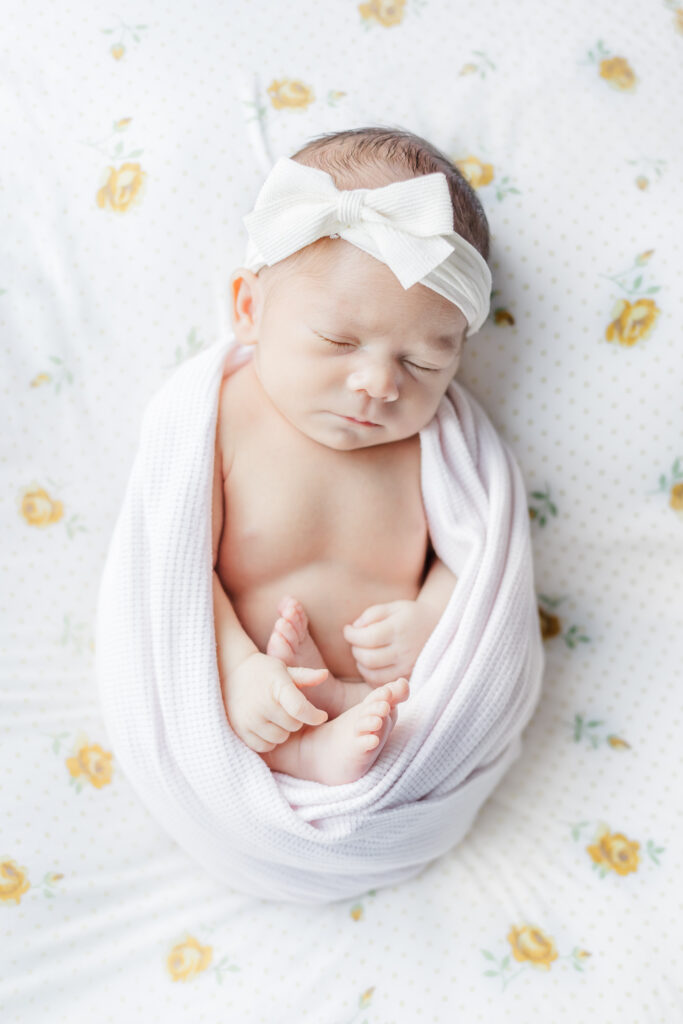 Baby Ella Jo with a peaceful expression while napping, captured during her in-home newborn session 