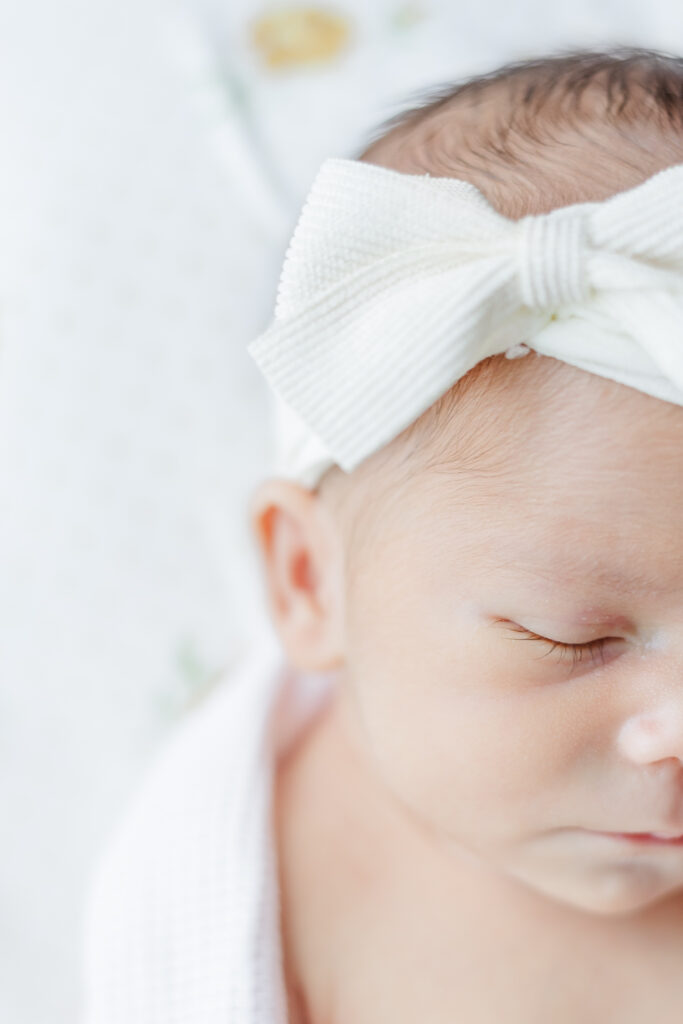 baby girl wearing a soft headband during photo session with 5U Photography