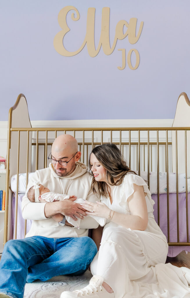 The Yonke family sharing a tender moment together with their newborn daughter, Ella Jo, in their Gardendale, Alabama home