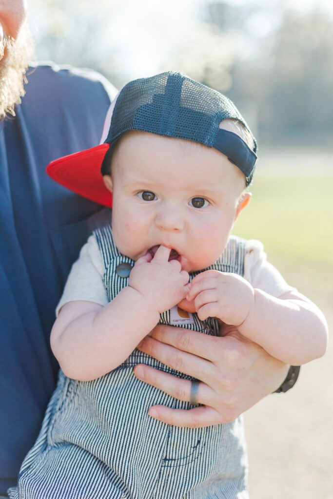 Close-up of baby’s toothless smile, showcasing the joy of their 6-month milestone.