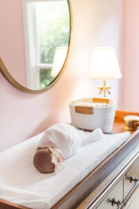 Eleanor laying in crib in family's home in highland lakes in birmingham al looking around peacefully